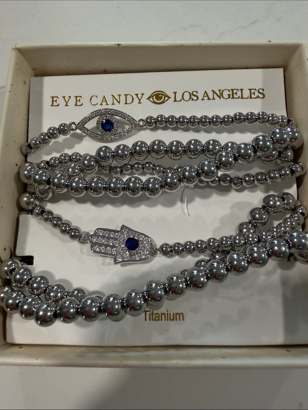 EYE CANDY 7 SILVER EVIL EYE & HAMSA BRACELETS